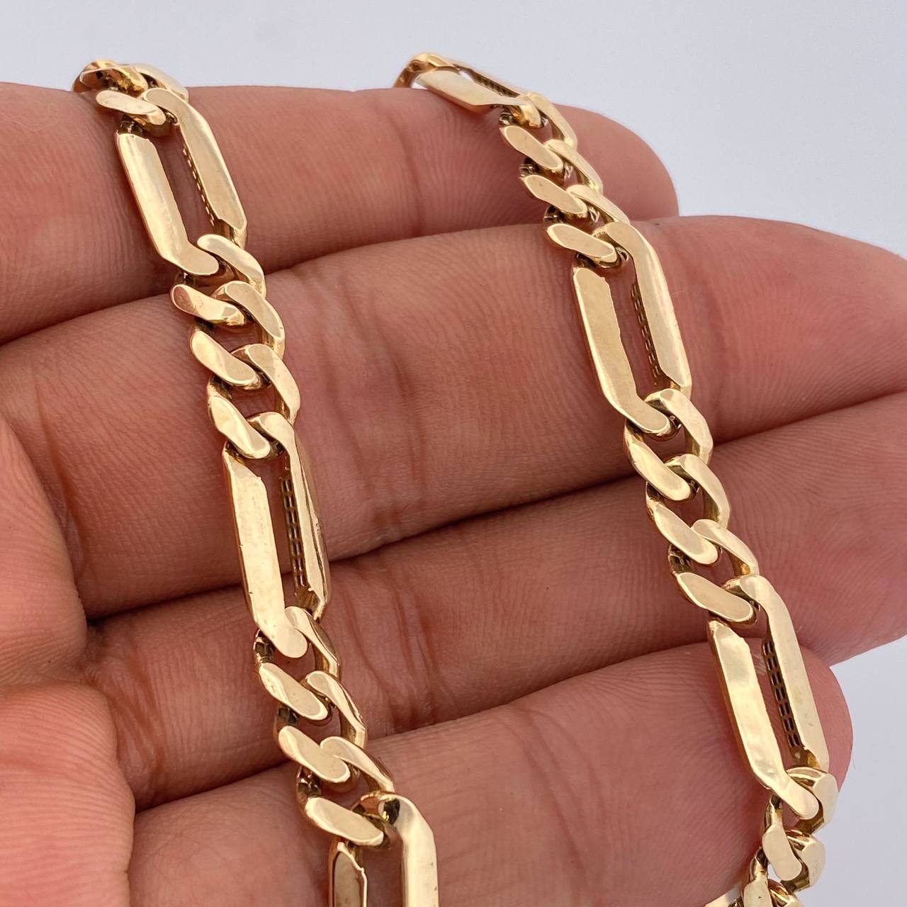 Cadena Figaro 31.25gr / 61.8cm / 7mm Oro Amarillo 18K +