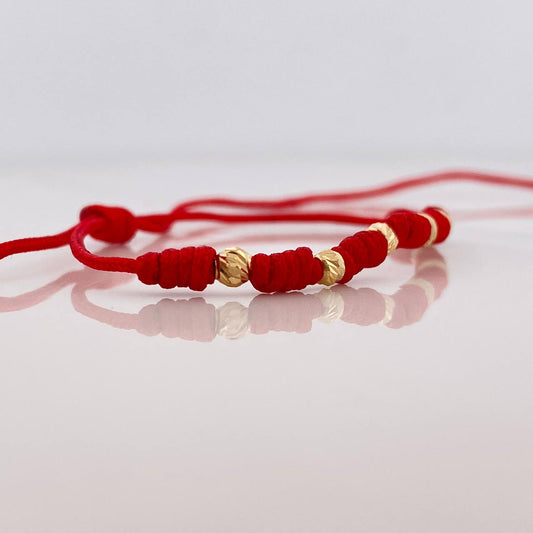 Pulsera Tejida Rojo Siete Nudos 6 Bolas Diamantadas Oro Amarillo 18K