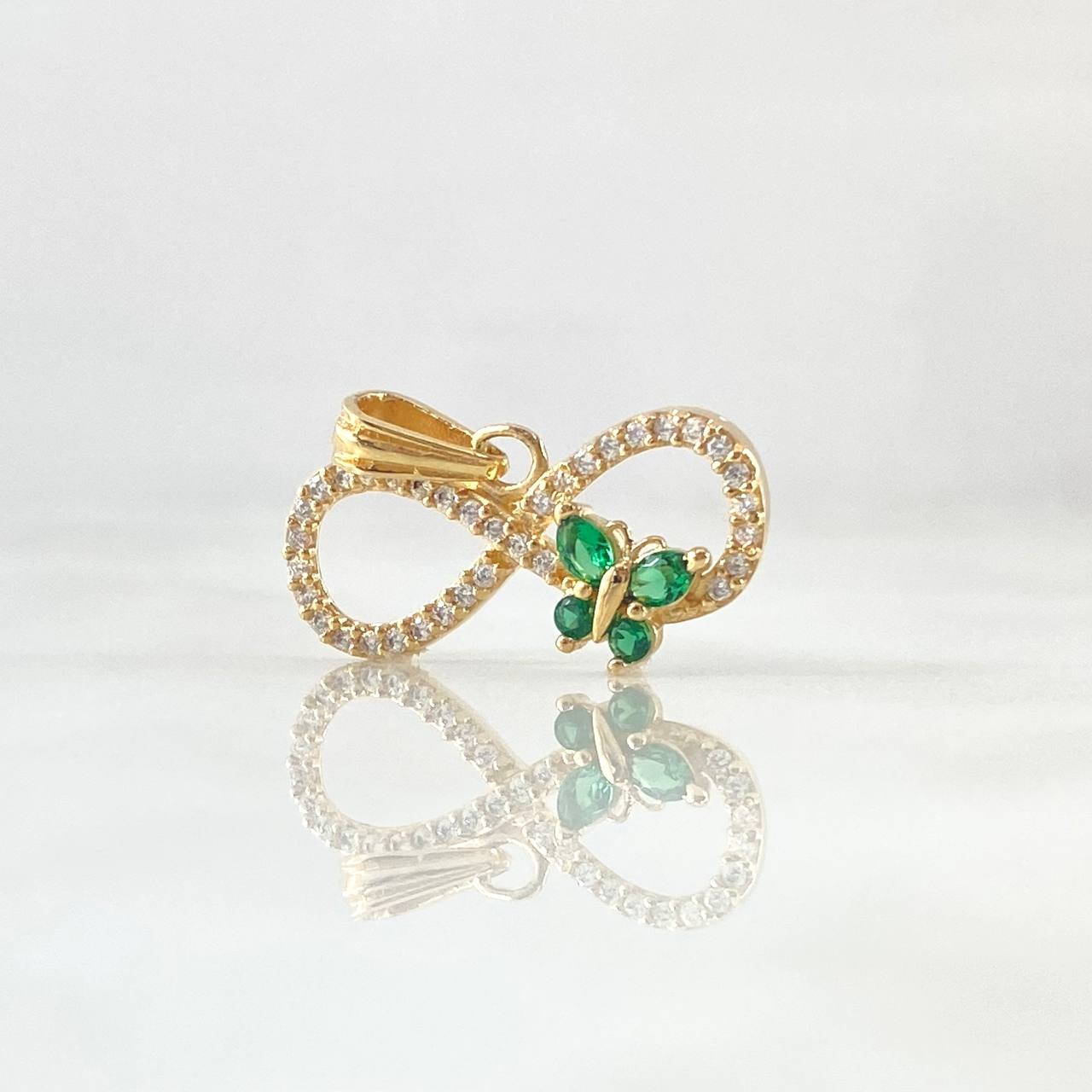Dije Infinito Tupido Mariposa 1.55gr / 1.5cm / Circones Blancos Verdes Oro Amarillo 18K ©