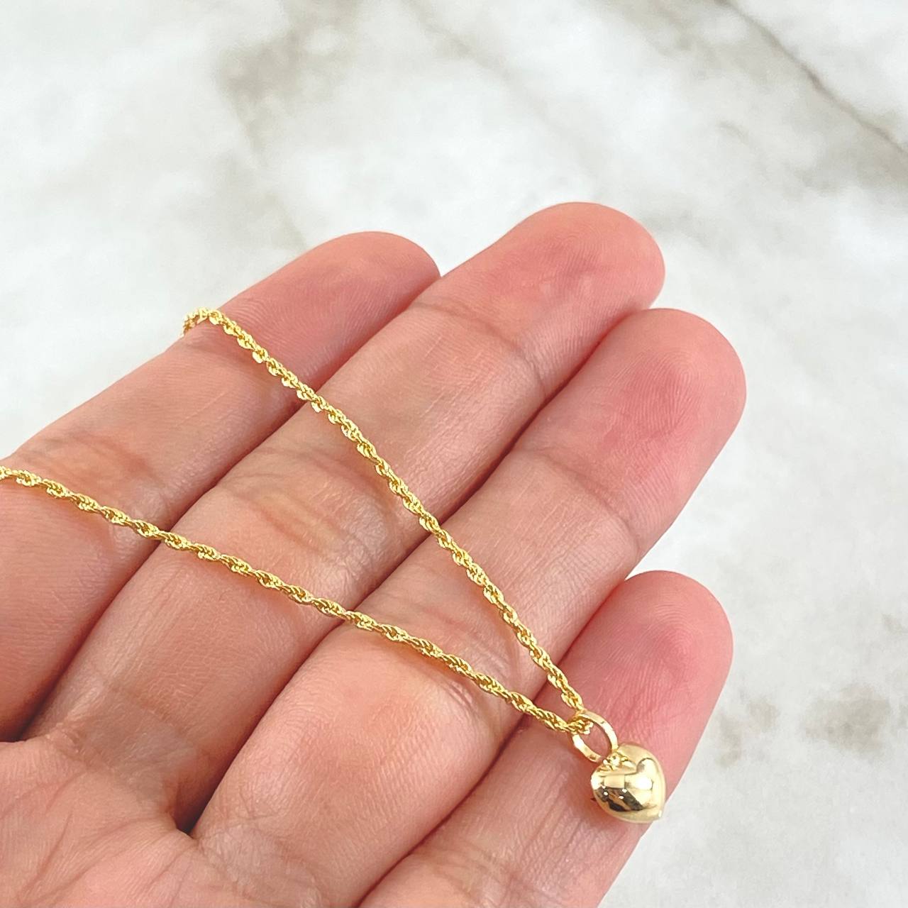 Set Cadena y Dije Lazo + Corazón Troquelado 1.4gr / Oro 18K (Oferta)