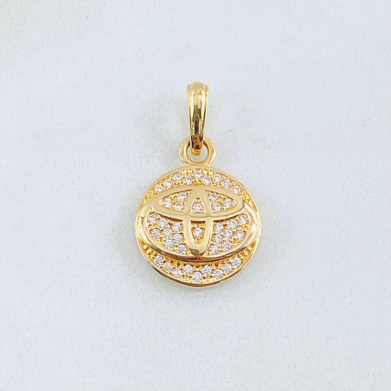 Dije Circulo Marca Automovil 2.35gr / 2.2cm / Oro Amarillo 18K