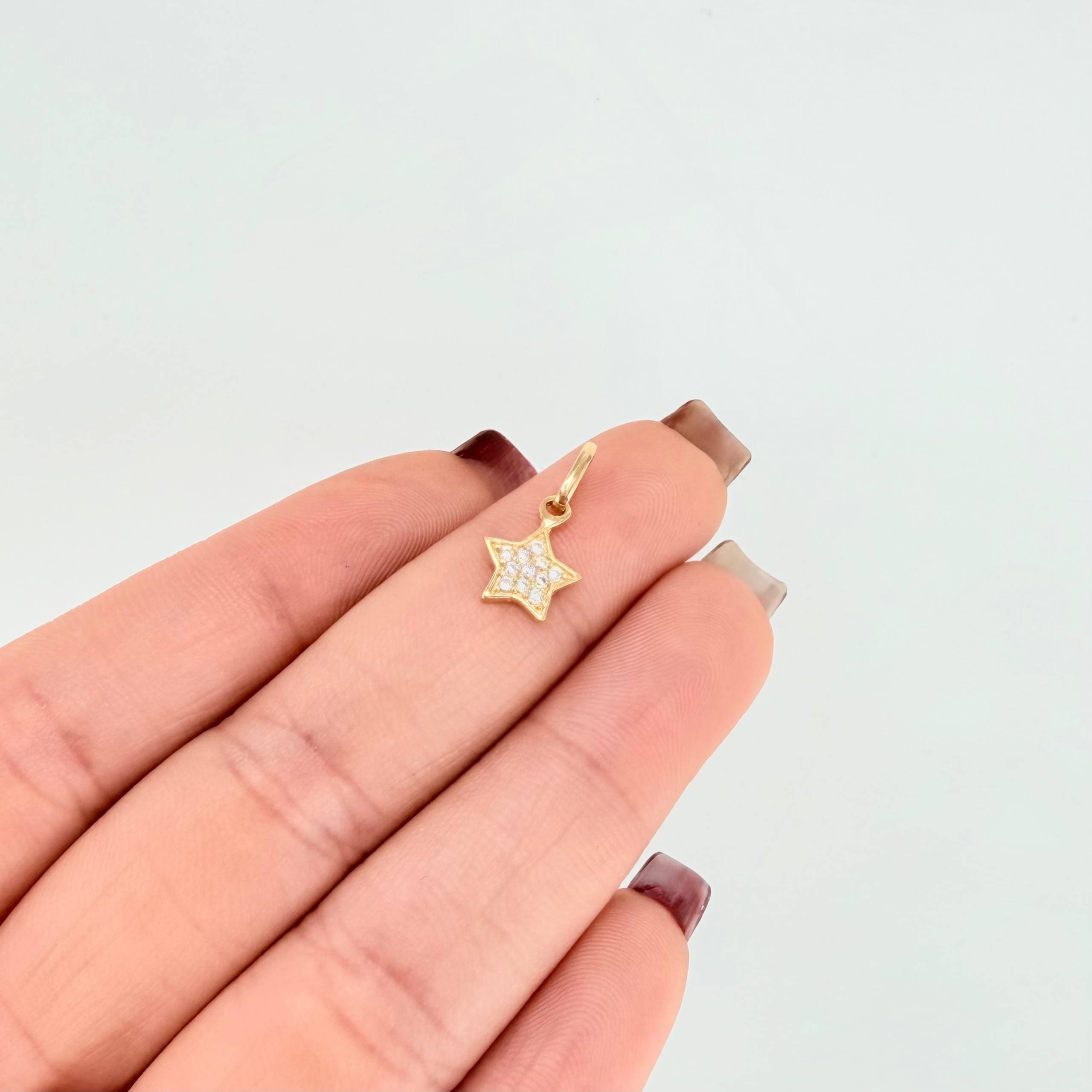 Dije Estrella Tupida 0.6gr / 1.5cm / Oro Amarillo 18K *