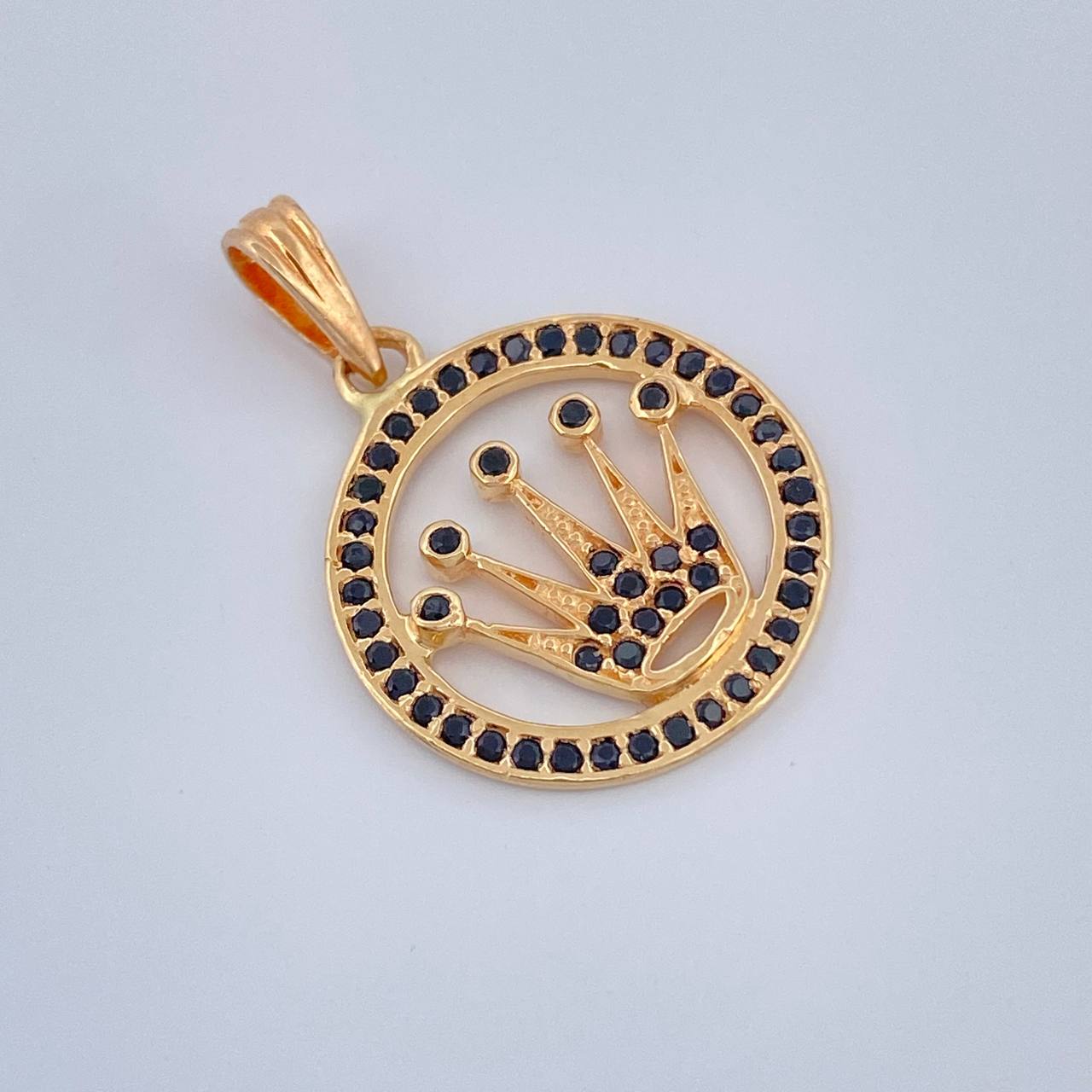 Dije Corona RX 1.65gr / 2.3cm / Circones Negros Oro Amarillo 18K $