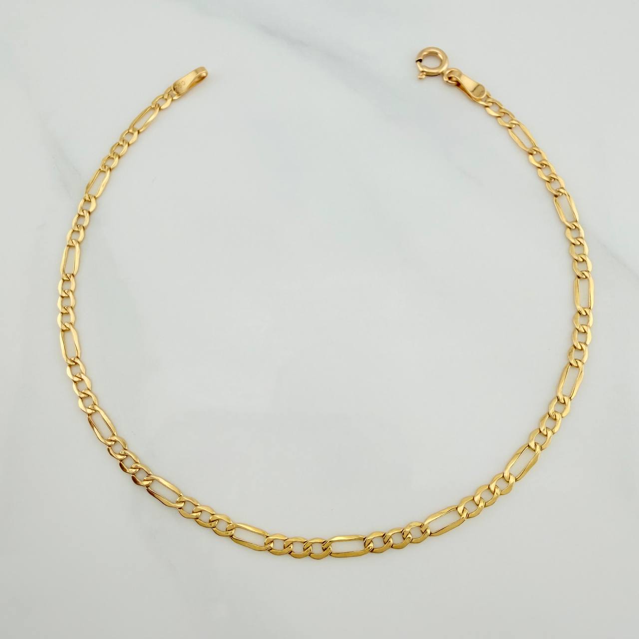 Pulso Figaro 1.2gr / 20.1cm / 2.55mm Oro Amarillo +1 18K $
