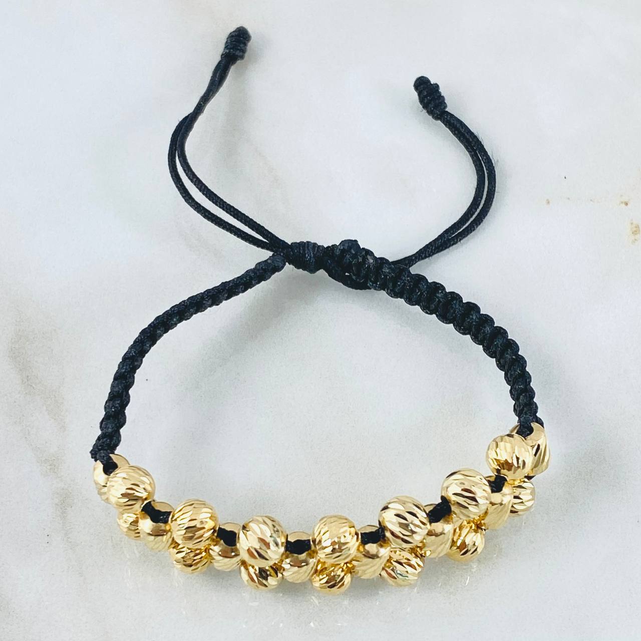 Pulsera Negra Bolas Cilindros 5.2gr / 6mm Oro Amarillo 18K ©