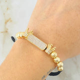 Pulsera Negra Herraje Rectangulo Coronas 9.6gr / 7mm-6mm Oro Amarillo 18K ©