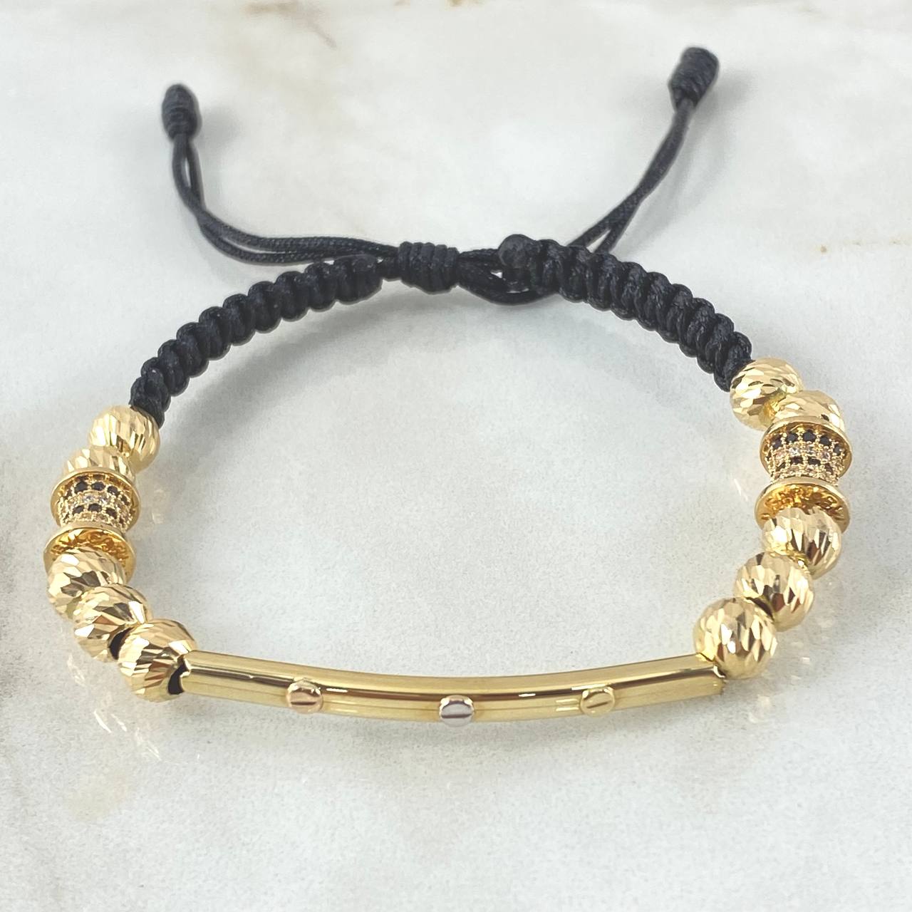 Pulsera Negra Herraje Cilindro Trio De Clavos 5.75gr / 6mm Bolas Diamantadas 10und Cilindros 2und Tres Oros 18K ©