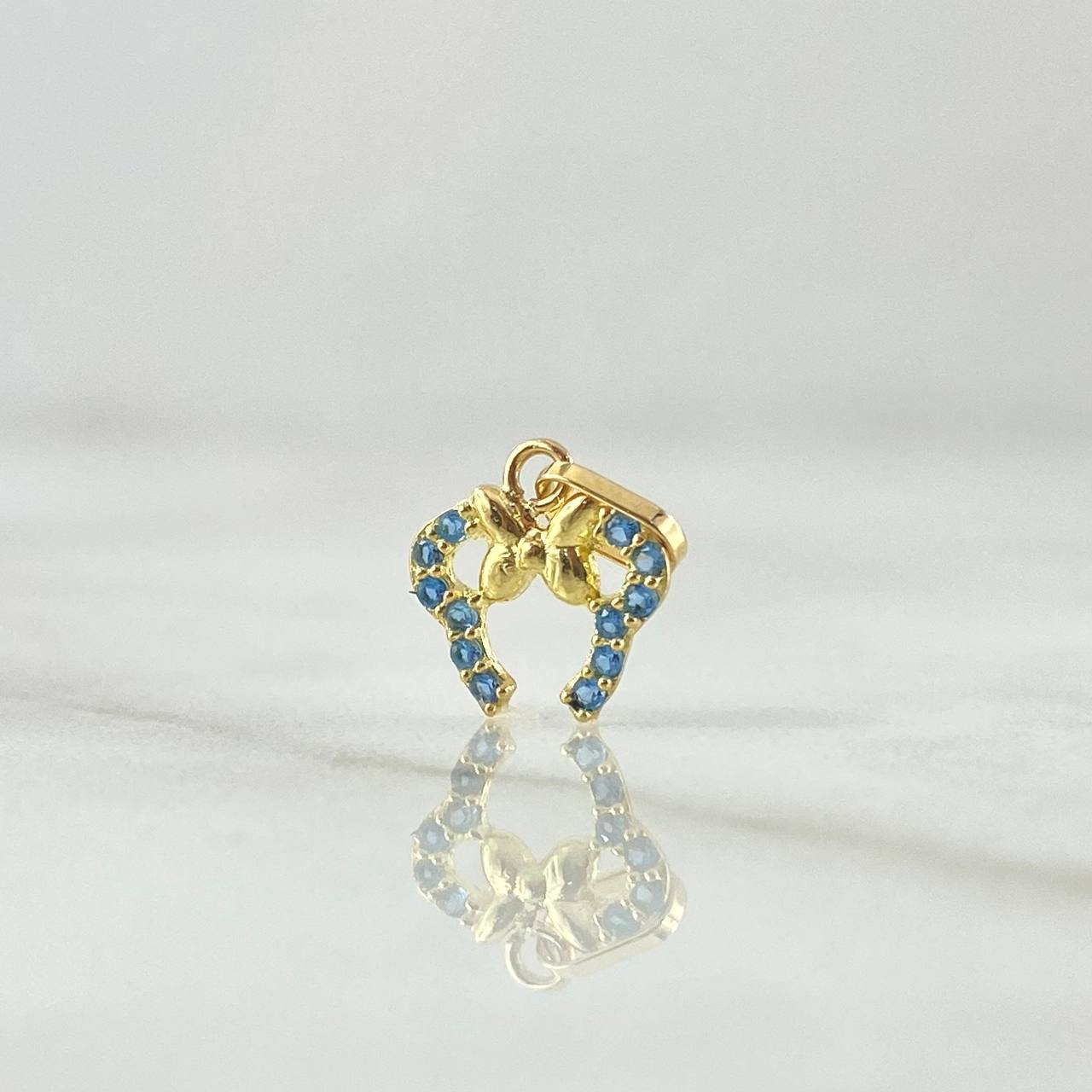 Dije Orejas De Ratón 0.4gr / 1.3cm / Circones Celestes Oro Amarillo 18K