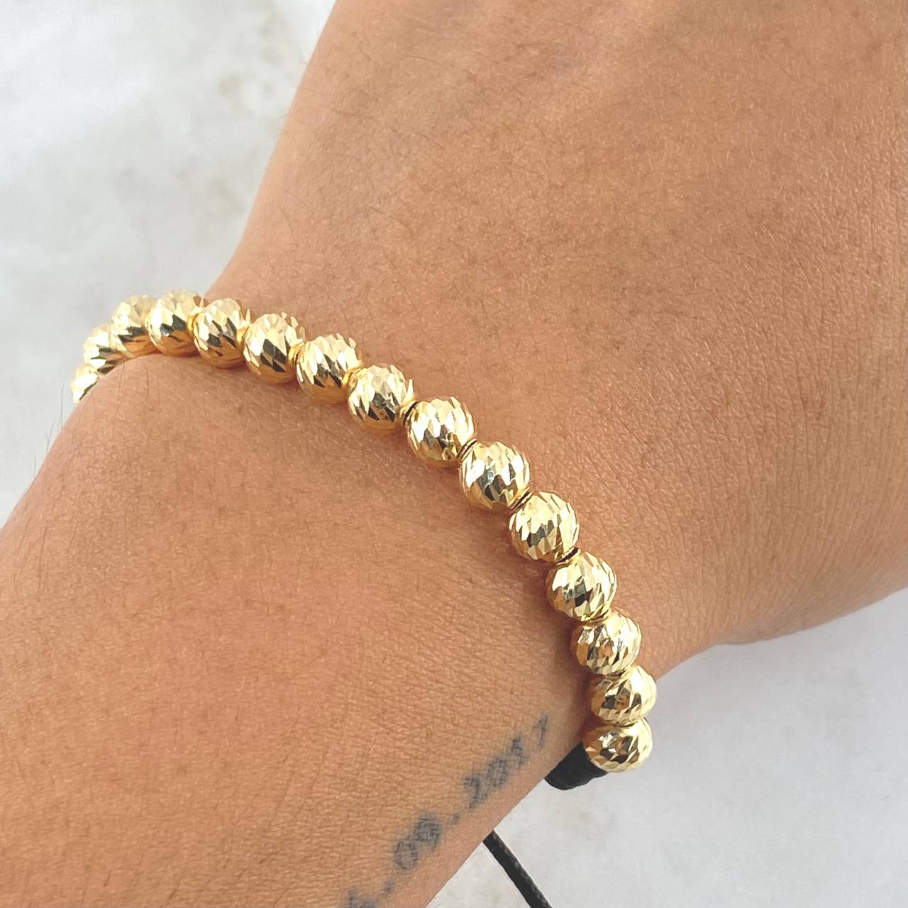 Pulsera Negra Bolas 3.65gr / 6mm Bolas Diamantadas 20und Oro Amarillo 18K ©