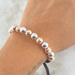 Pulsera Negra Bolas 5gr / 8mm Diamantadas 8und - Lisas 7und Dos Oros Blanco Rosa 18K ©