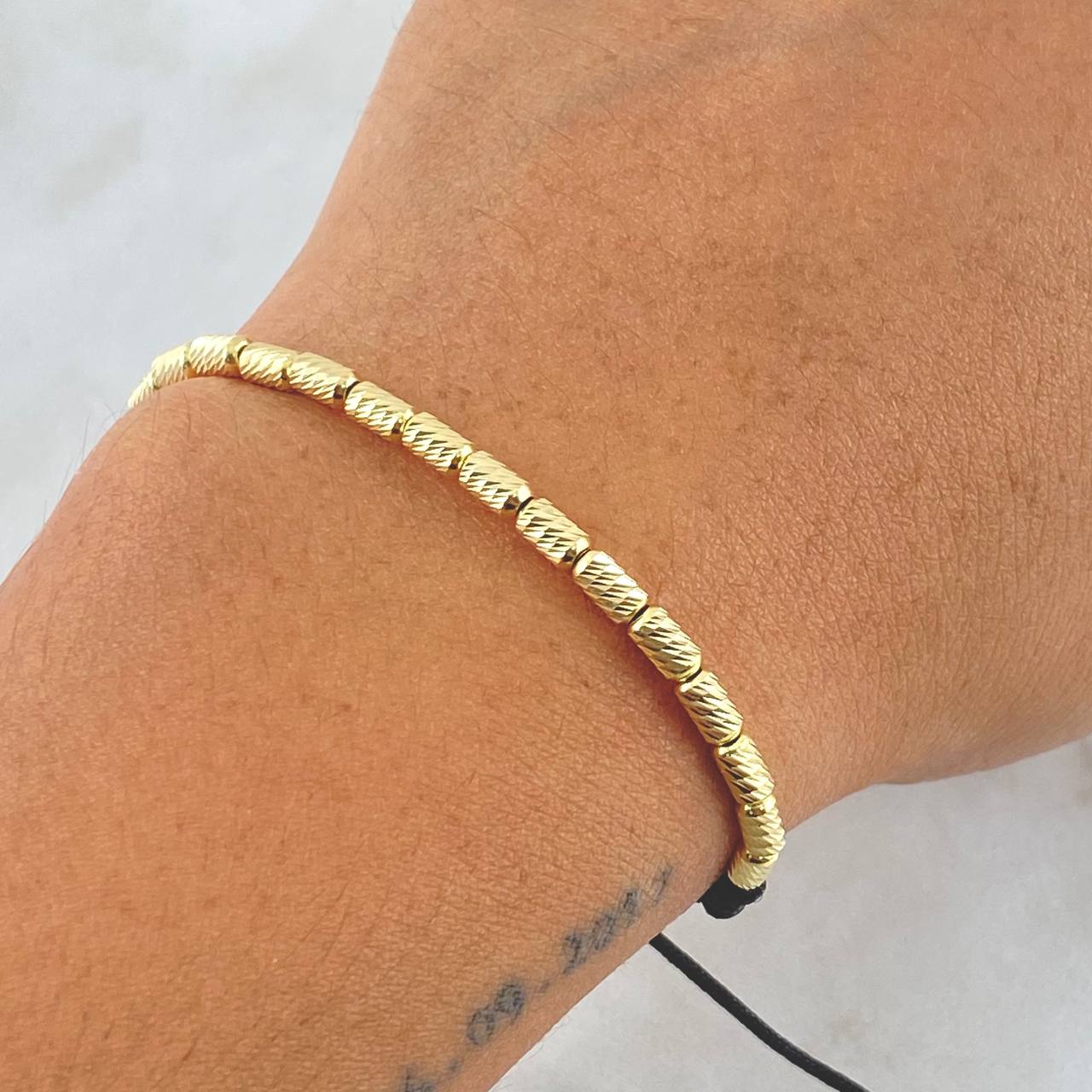 Pulsera Negra Cilindro 1.95gr / 3mm Diamantados 18und Oro Amarillo 18K *