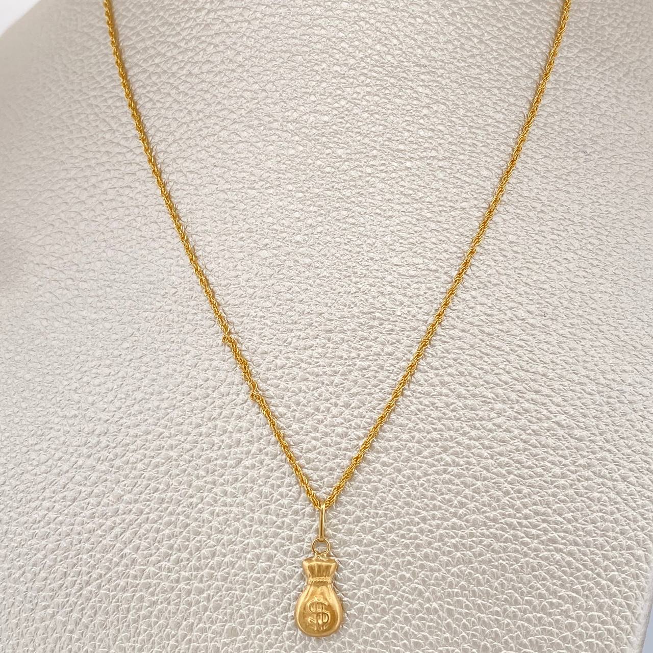 Set Cadena y Dije Lazo + Bolsa De Dinero 1.2gr / 40cm / Oro Amarillo 18K (Oferta) $