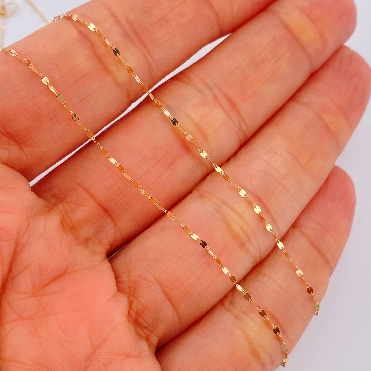 Set Cadena y Dije Flor Espejo + Divino Niño 0.65gr / 45cm / Oro Amarillo 18K $