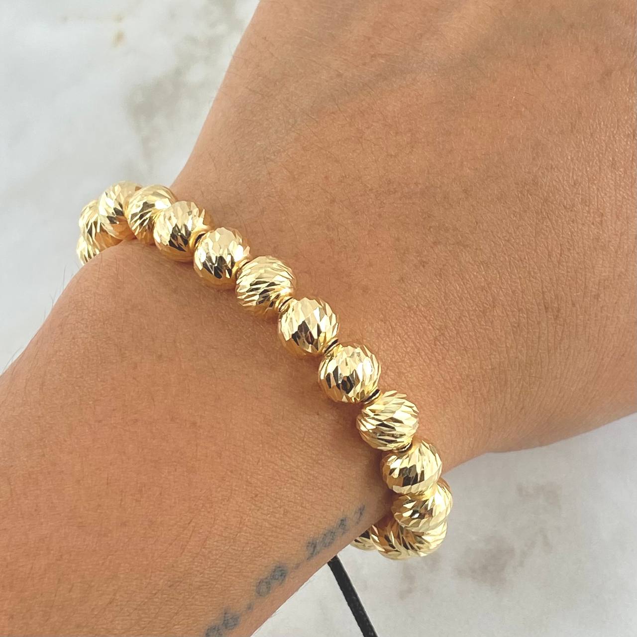 Pulsera Negra Bolas 6.3gr / 8mm Bolas Diamantadas 18und Oro Amarillo 18K ©