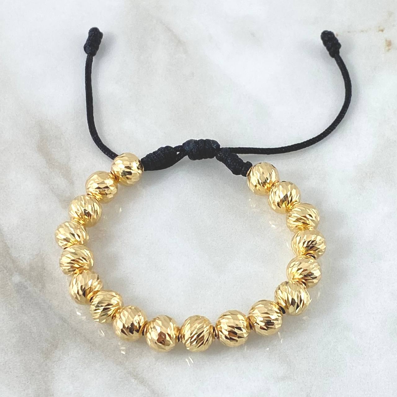 Pulsera Negra Bolas 6.3gr / 8mm Bolas Diamantadas 18und Oro Amarillo 18K ©