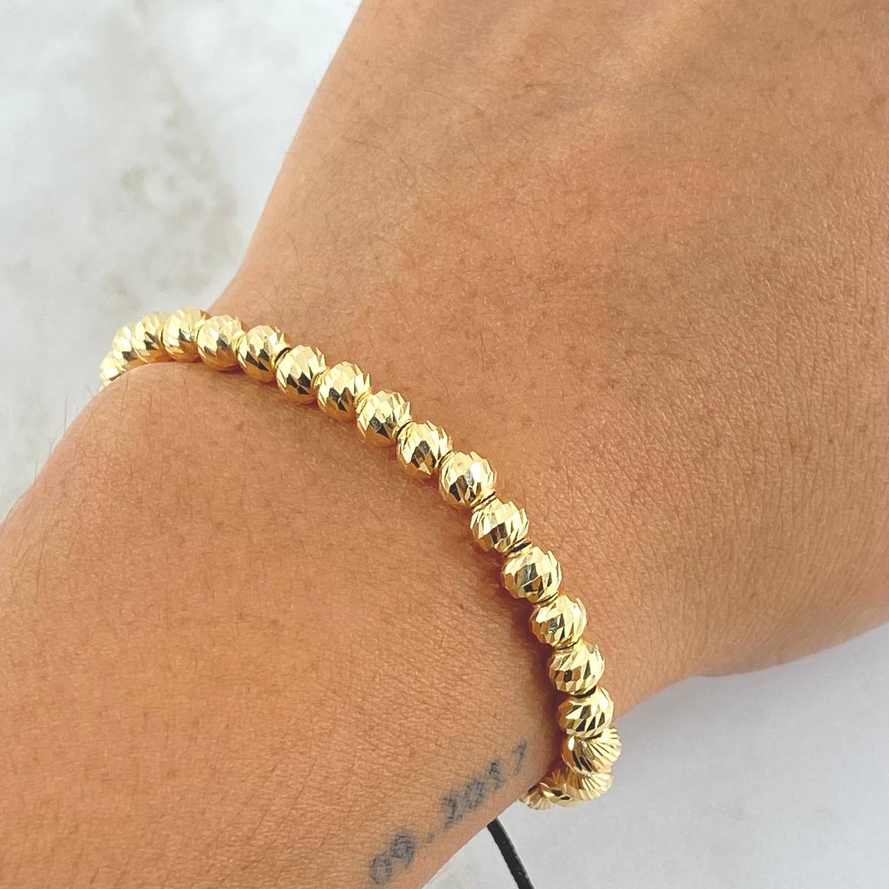 Pulsera Negra Bolas 4.15gr / 5mm Diamantadas 30und Oro Amarillo 18K ©