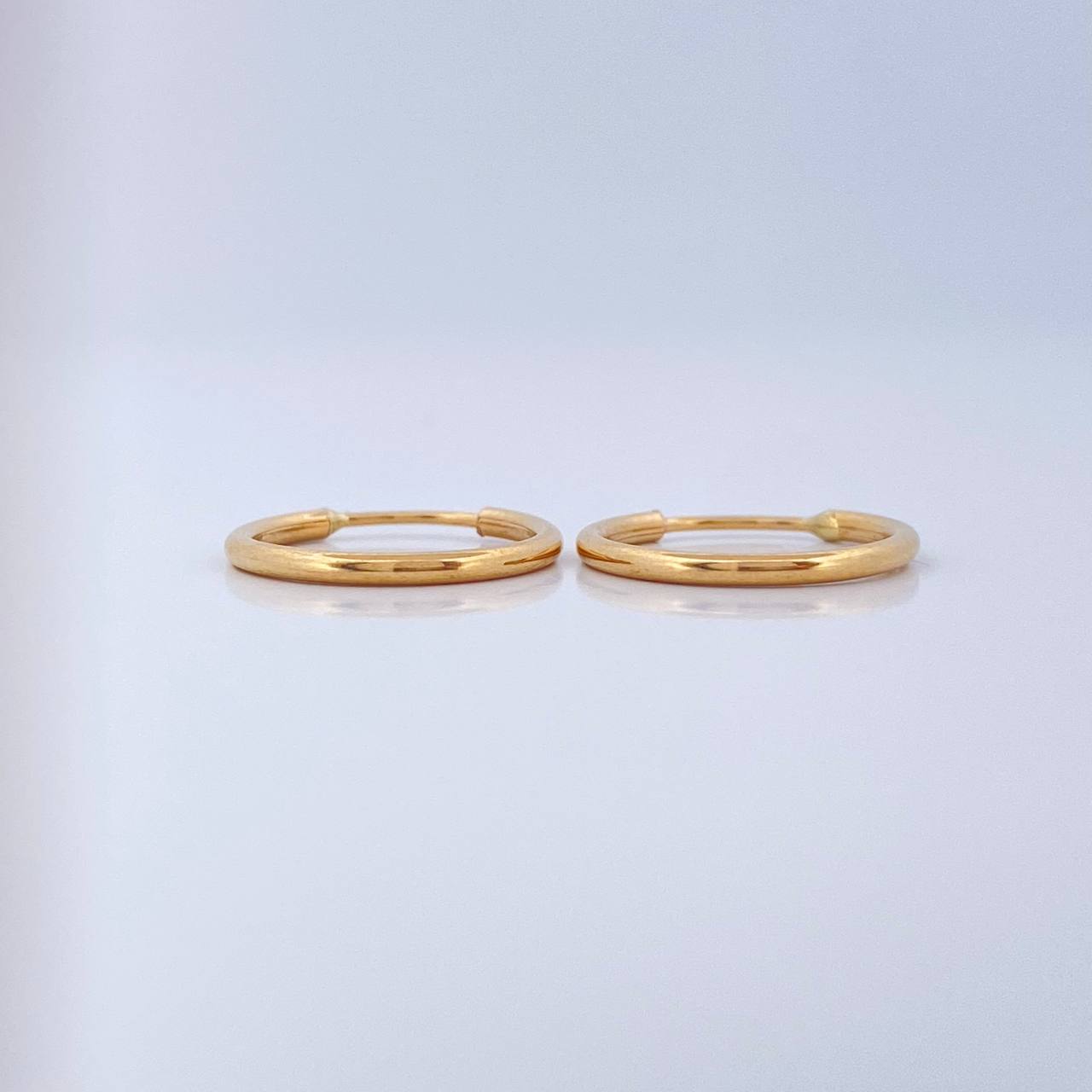 Candongas Aro Liso 0.65gr / 1.4cm / Oro Amarillo 18K $
