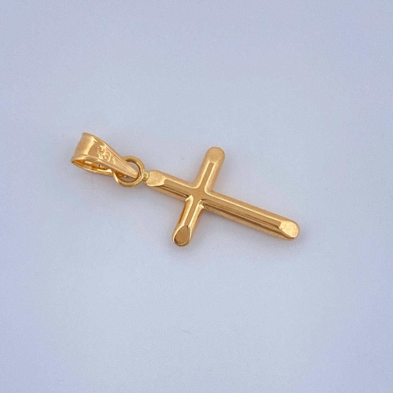 Dije Cruz 0.4gr / 2.3cm / Oro Amarillo 18K $