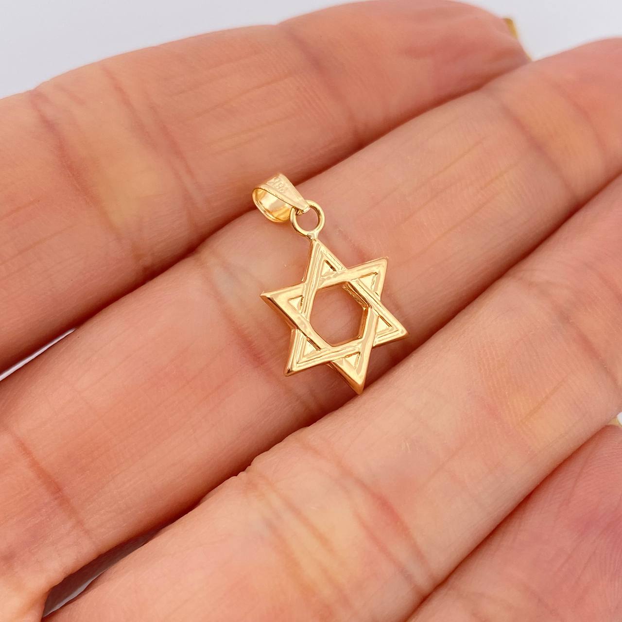 Dije Estrella De David 0.55gr / 2cm / Oro Amarillo 18K $