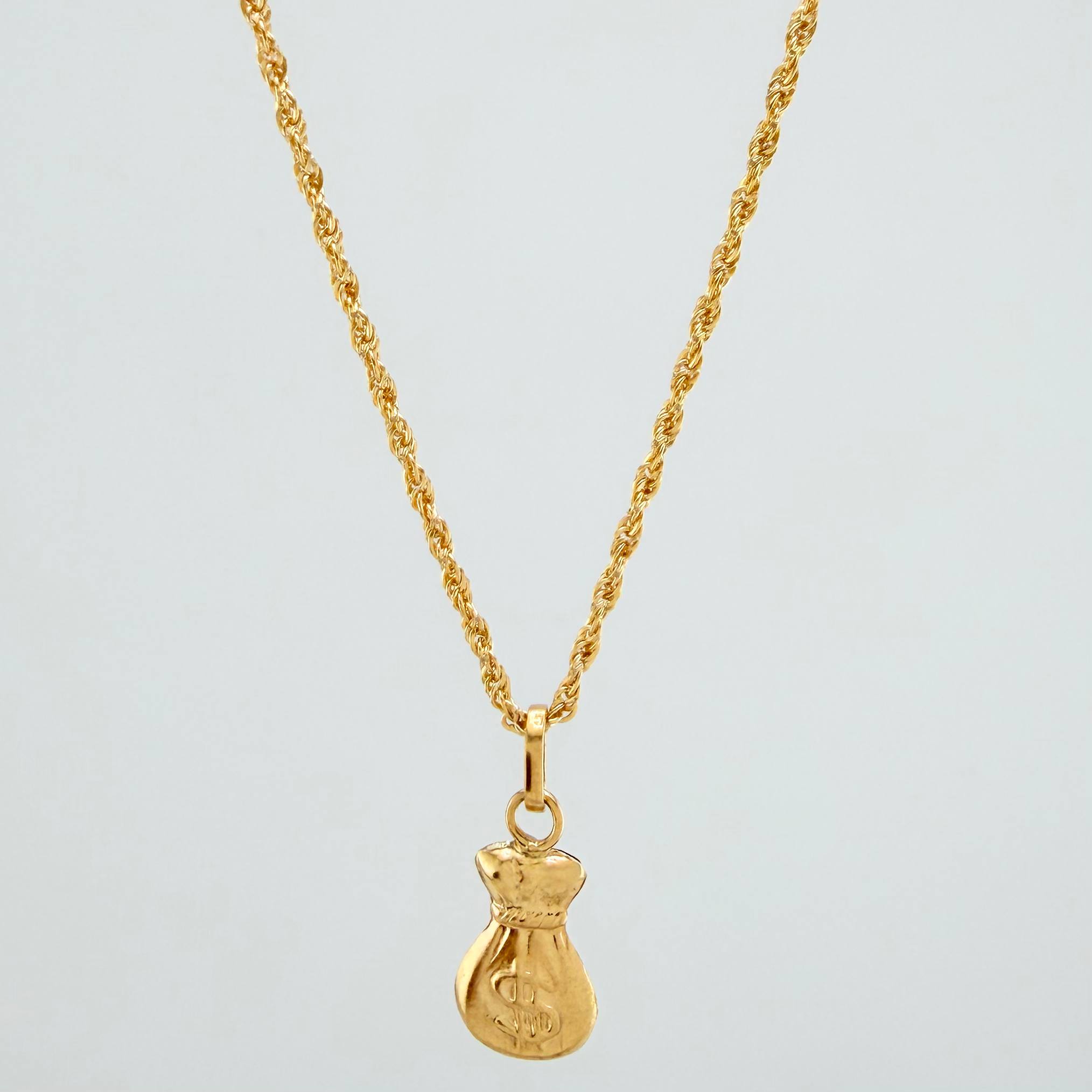 Set Cadena Lazo + Dije Bolsa Dinero / 1.6gr / 59.5 cm Oro Amarillo 18K