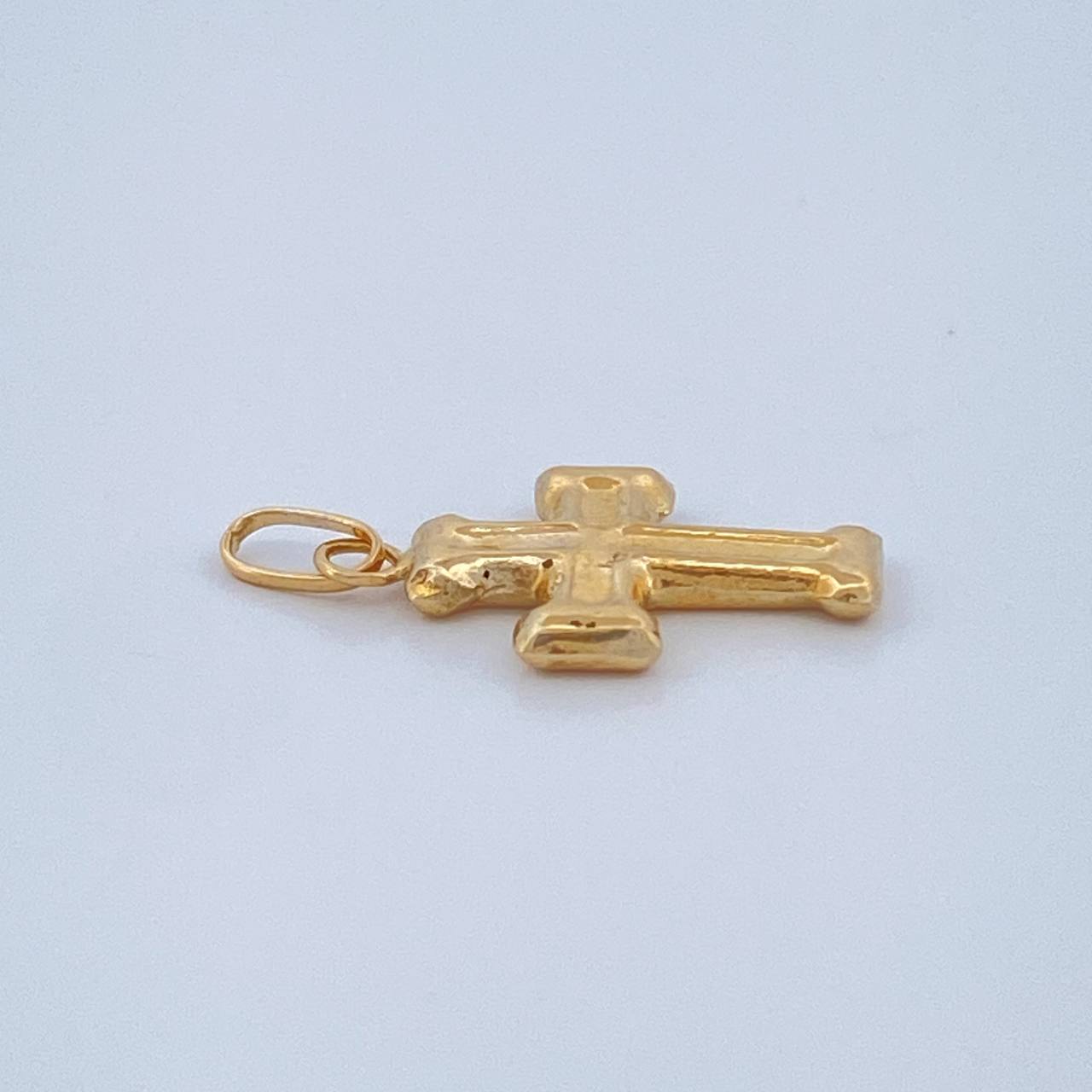 Dije Cruz 0.4gr / 1.9cm / Oro Amarillo 18K $