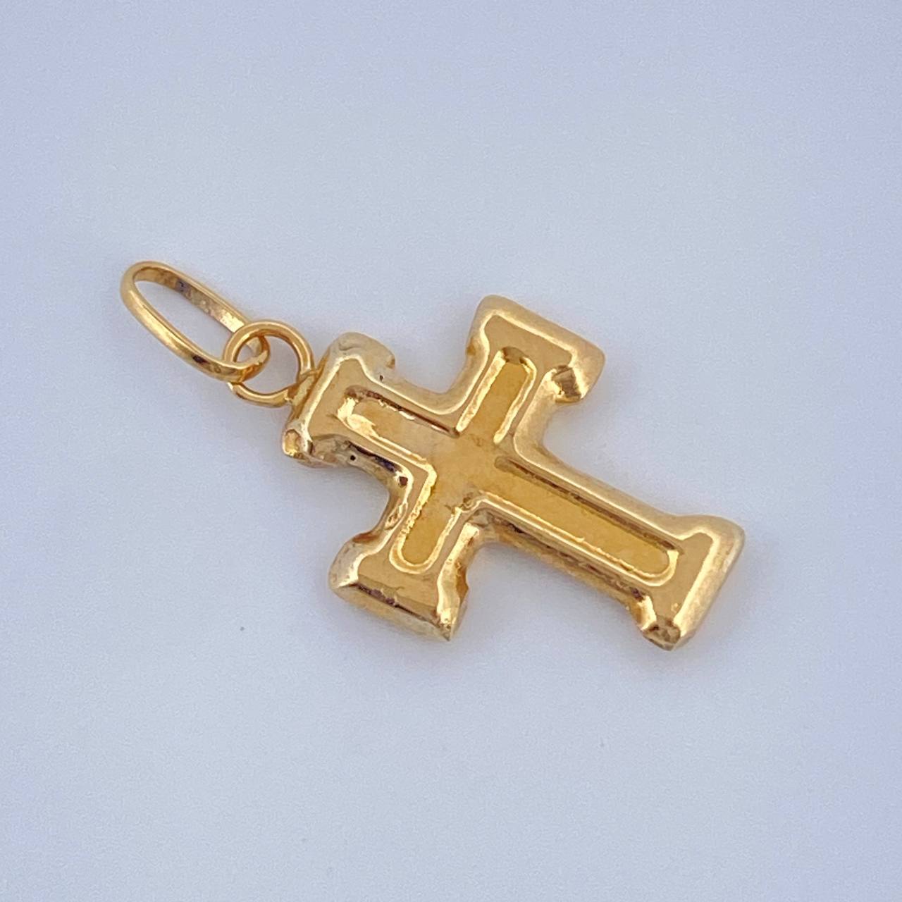 Dije Cruz 0.4gr / 1.9cm / Oro Amarillo 18K $