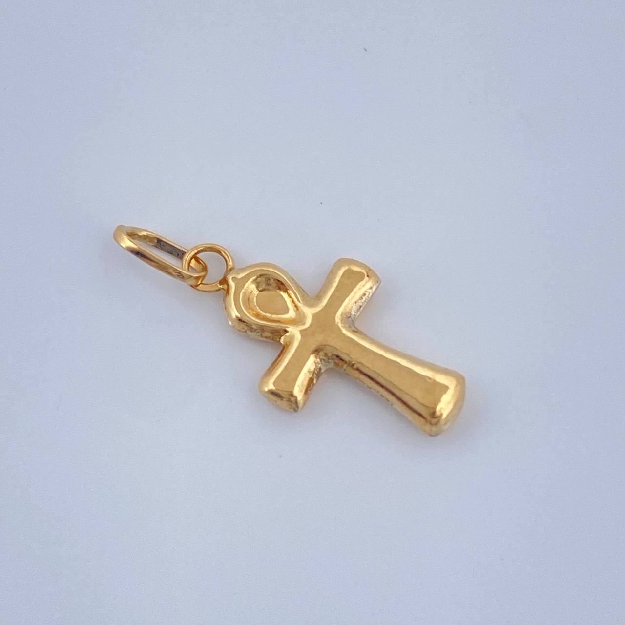 Dije Cruz Egipcia 0.3gr / 2cm / Oro Amarillo 18K $