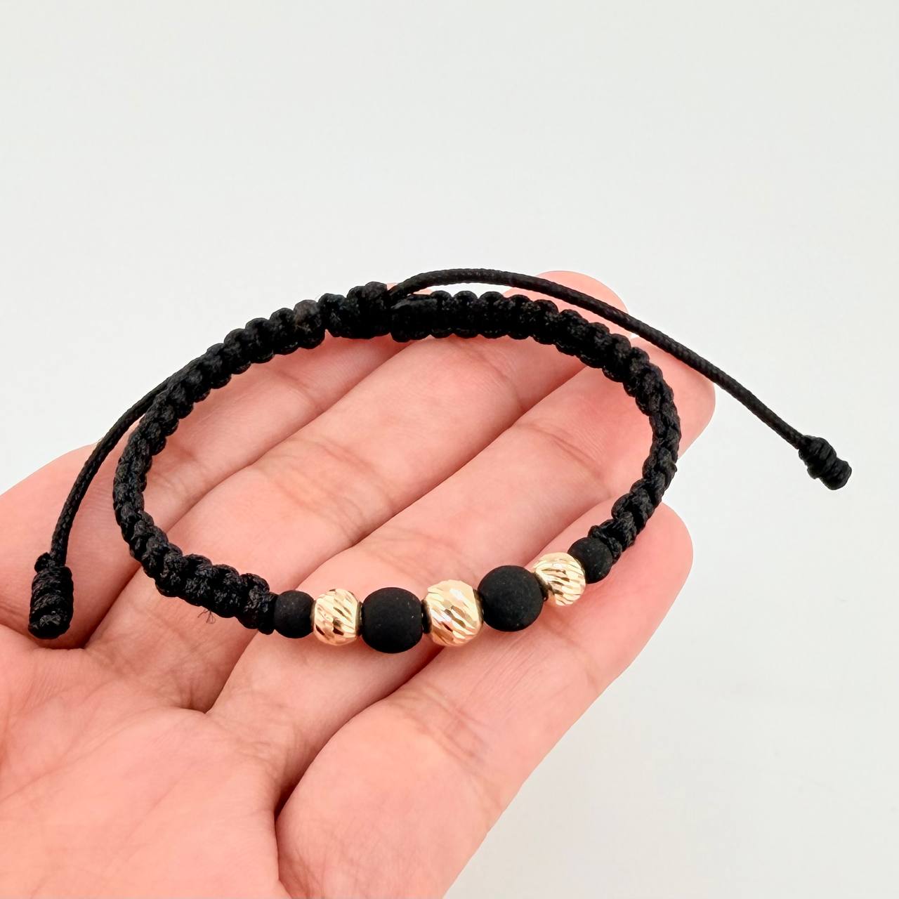 Pulsera Tejida Negra Neoprenos Bolas Diamantadas Oro Amarillo 18K