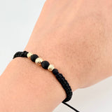 Pulsera Tejida Negra Neoprenos Bolas Diamantadas Oro Amarillo 18K