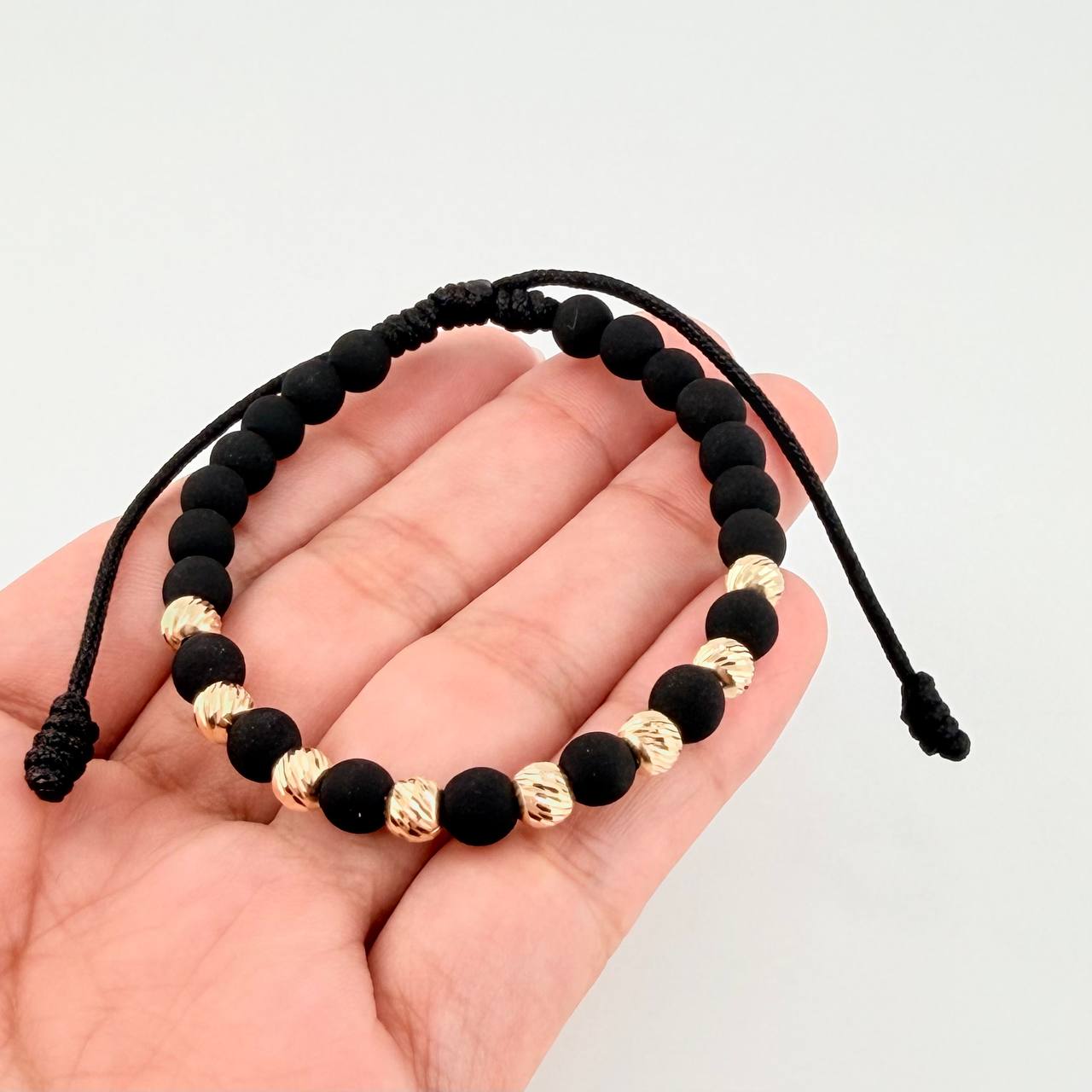 Pulsera Tejida Negra Neoprenos Bolas Diamantadas Oro Amarillo 18K