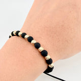 Pulsera Tejida Negra Neoprenos Bolas Diamantadas Oro Amarillo 18K