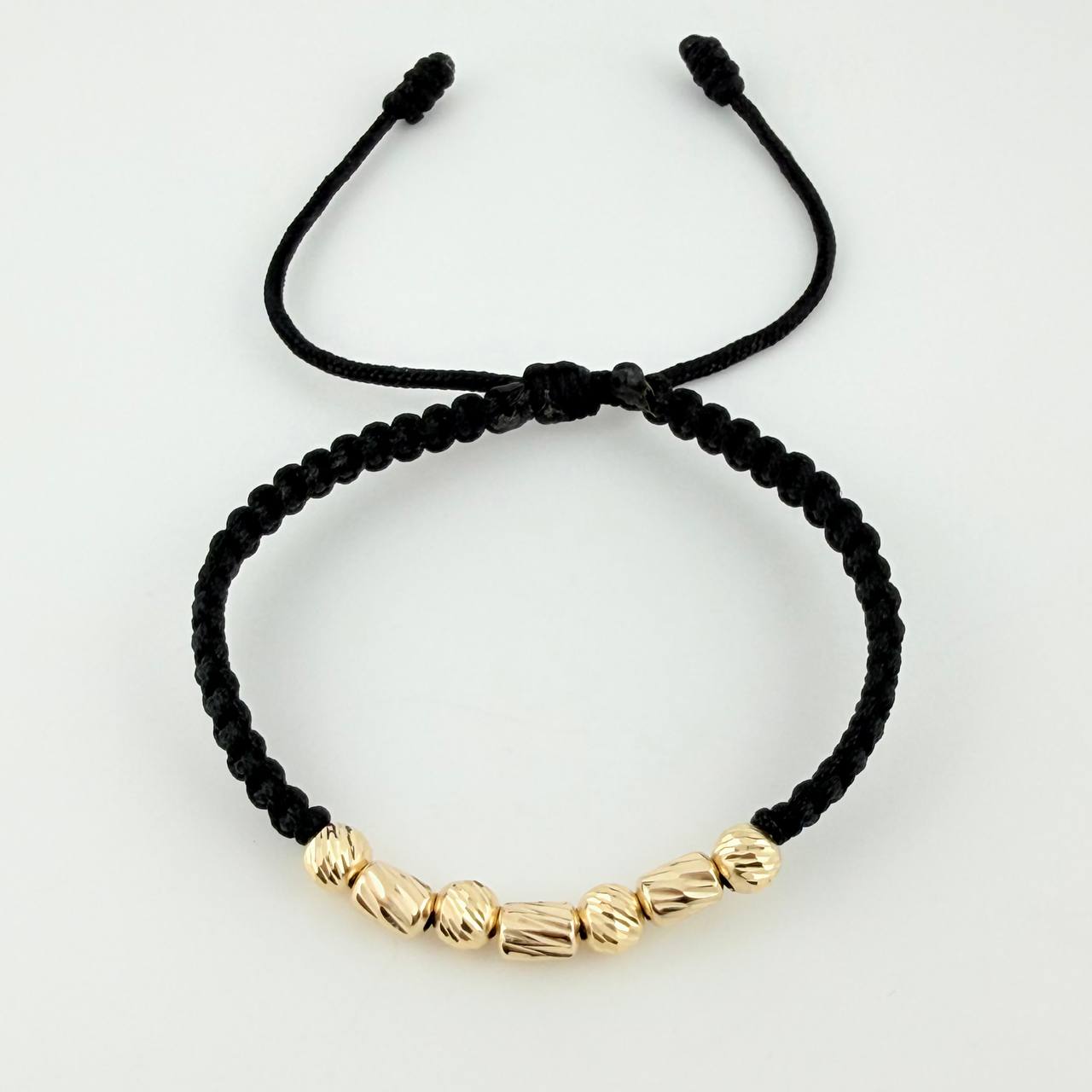 Pulsera Tejida Negra Cilindros Intercalados Bolas Diamantadas Oro Amarillo 18K