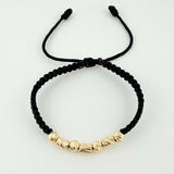 Pulsera Tejida Negra Cilindros Intercalados Bolas Diamantadas Oro Amarillo 18K