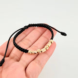 Pulsera Tejida Negra Cilindros Intercalados Bolas Diamantadas Oro Amarillo 18K
