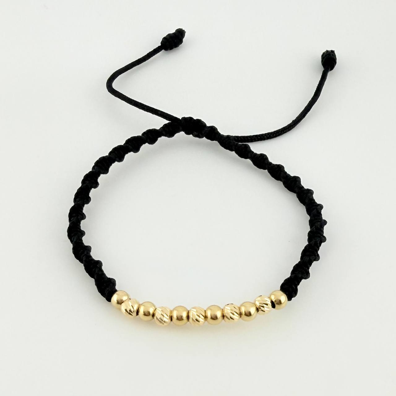 Pulsera Tejida Negra Bolas Diamantadas/ Lisas Oro Amarillo 18K