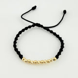 Pulsera Tejida Negra Bolas Diamantadas/ Lisas Oro Amarillo 18K