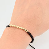 Pulsera Tejida Negra Bolas Diamantadas/ Lisas Oro Amarillo 18K