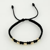 Pulsera Tejida Negra Bolas Diamantadas Oro Amarillo 18K