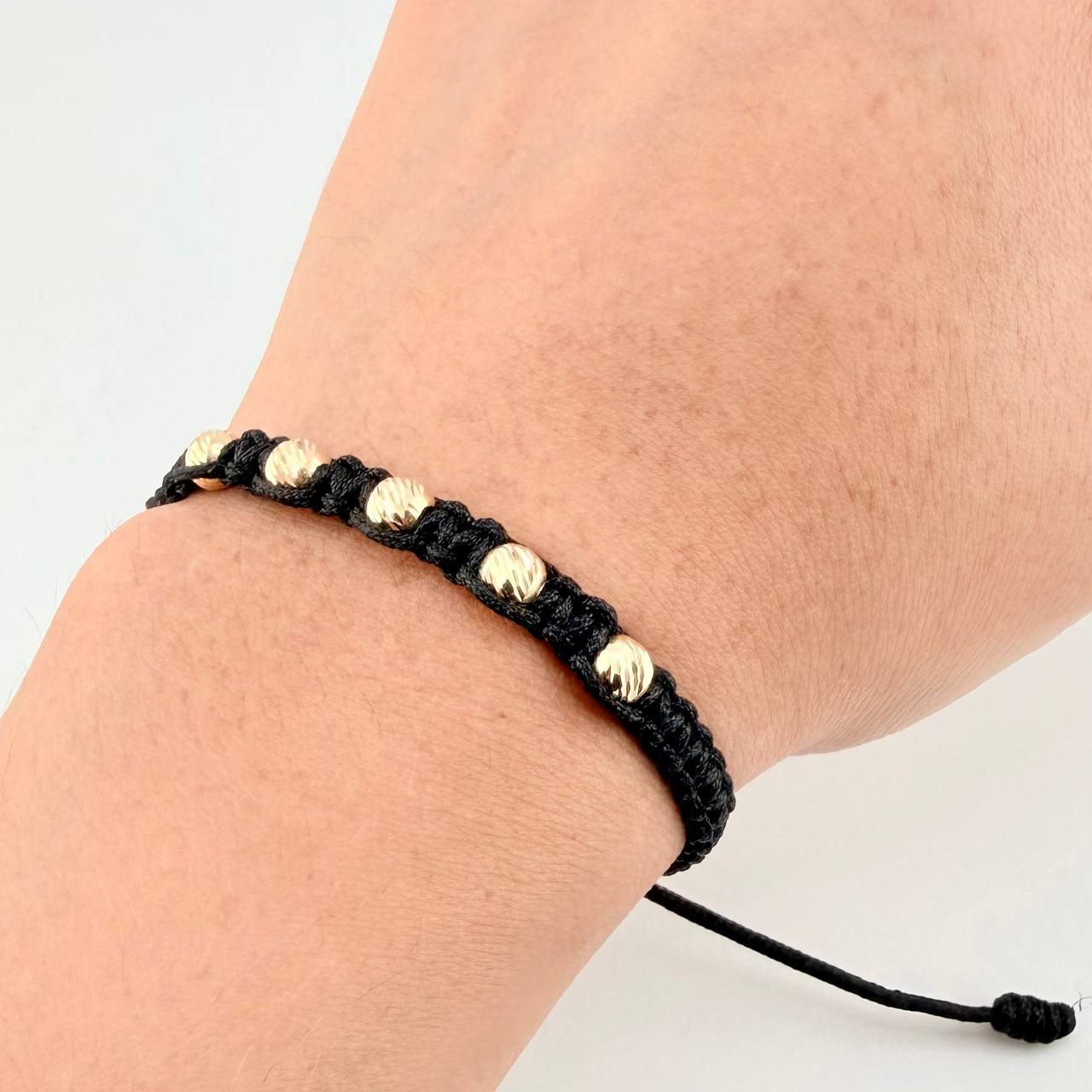 Pulsera Tejida Negra Bolas Diamantadas Oro Amarillo 18K