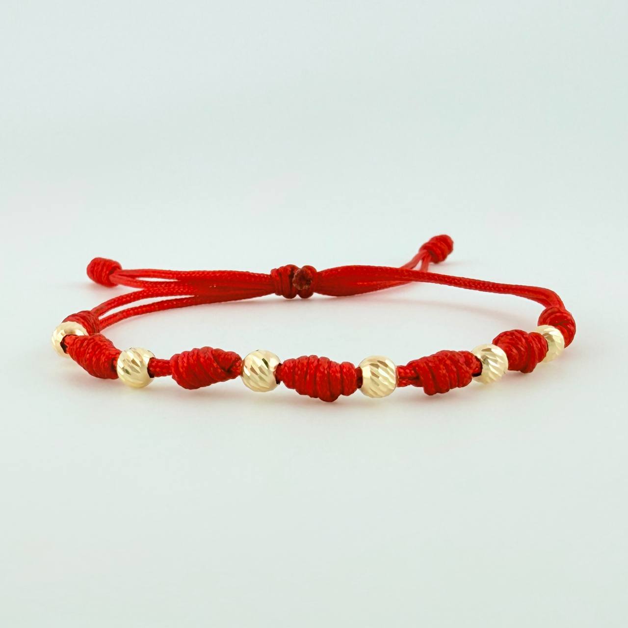Pulsera Tejida Roja Siete Nudos Bolas Diamantadas Oro Amarillo 18K