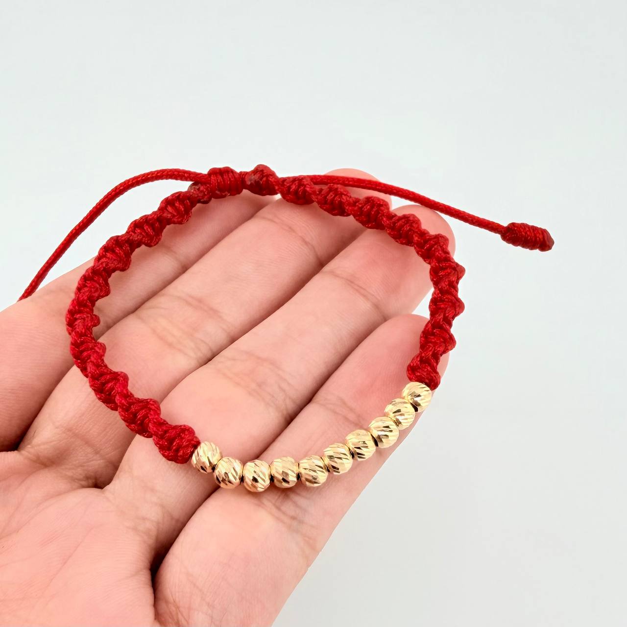 Pulsera Tejida Roja Bolas Diamantadas Oro Amarillo 18K