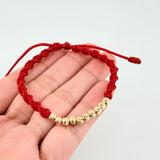 Pulsera Tejida Roja Bolas Diamantadas Oro Amarillo 18K