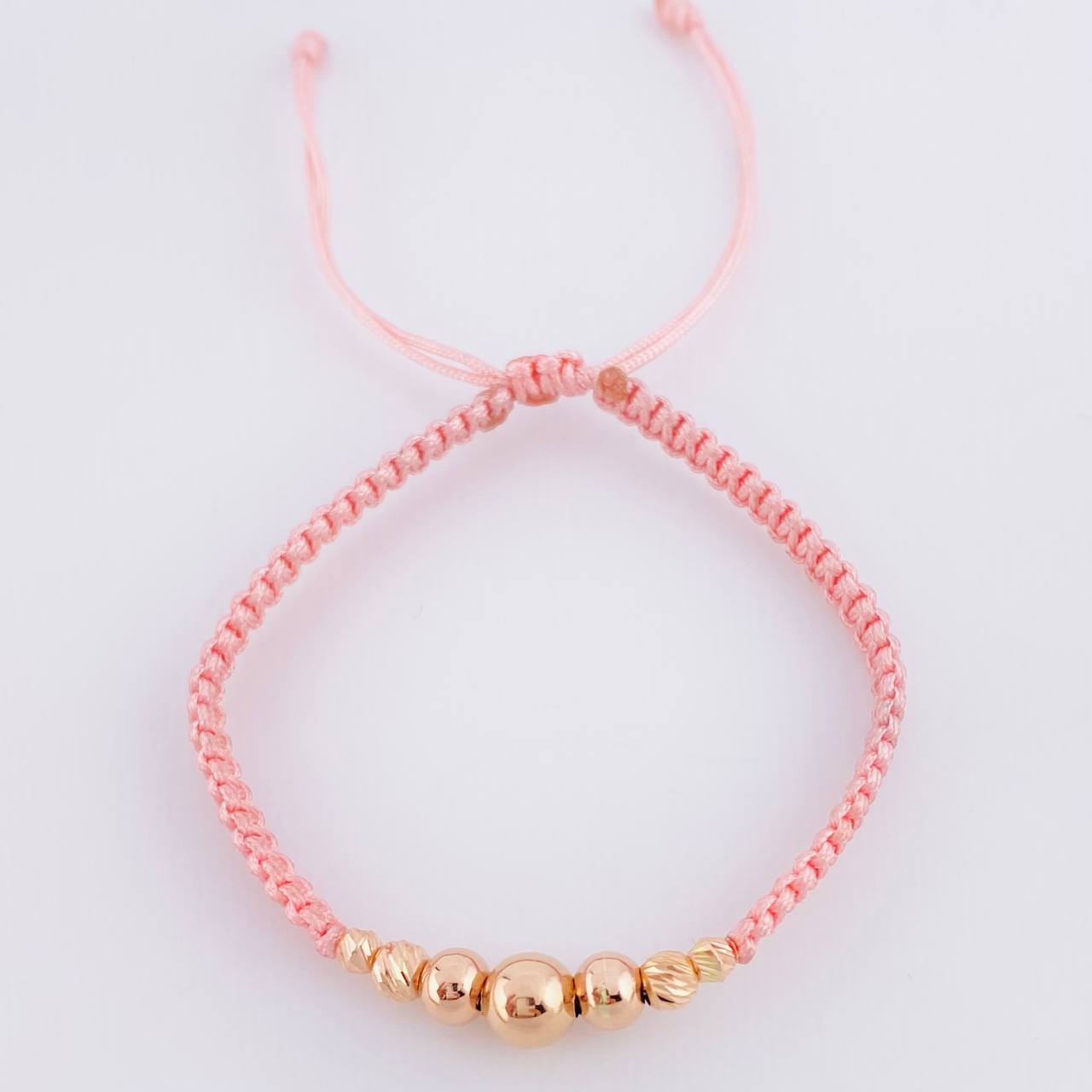 Pulsera Tejida Rosada Bolas Lisas/ Diamantadas Oro Amarillo 18K