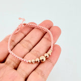Pulsera Tejida Rosada Bolas Lisas/ Diamantadas Oro Amarillo 18K