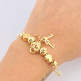 Pulso PD Llave Corazón Bolas Diamantadas 13.55gr / 17.5cm / Oro Amarillo 18K ©