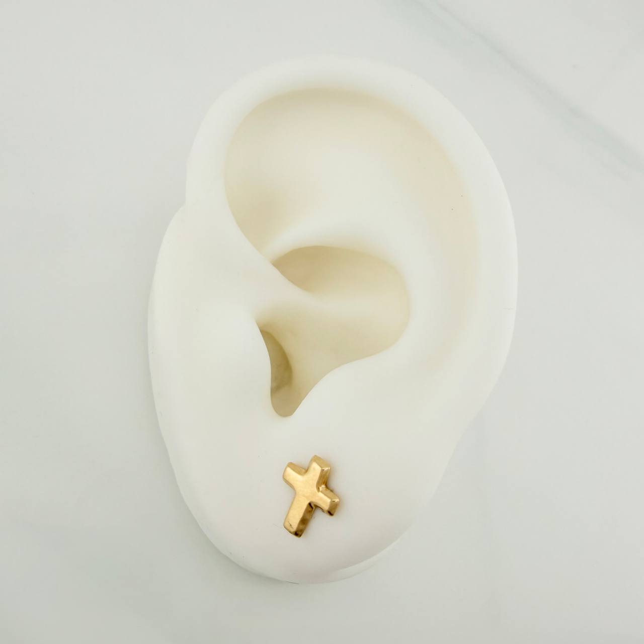 Topos Cruz 0.6gr / 9.14mm Oro Amarillo 18K %