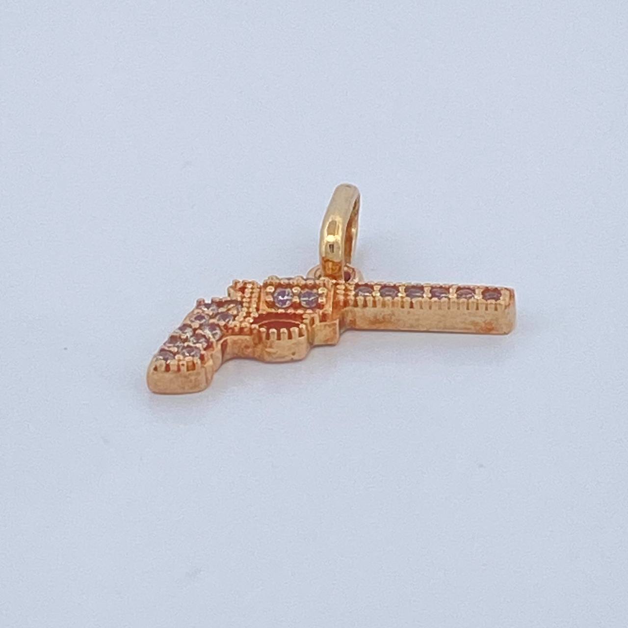 Dije Revolver 1.05gr / 1.8cm / Oro Amarillo  18K $