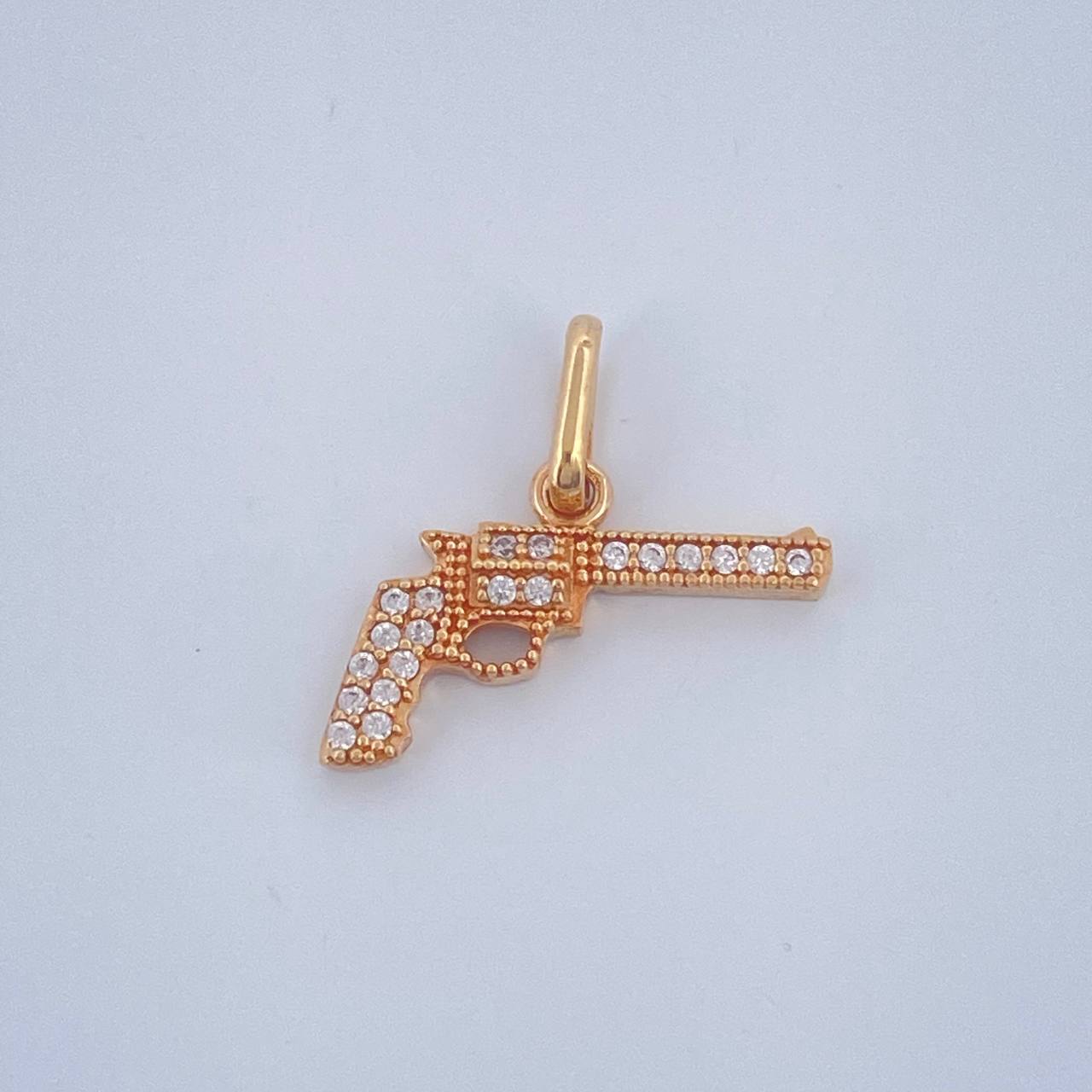 Dije Revolver 1.05gr / 1.8cm / Oro Amarillo  18K $