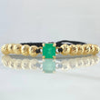 Pulsera Negra Herraje Caja Cuatro Garras 4gr / 6mm Bolas Diamantadas 12und Esmeralda 1.70 Qts Oro Amarillo 18K (Joya) *