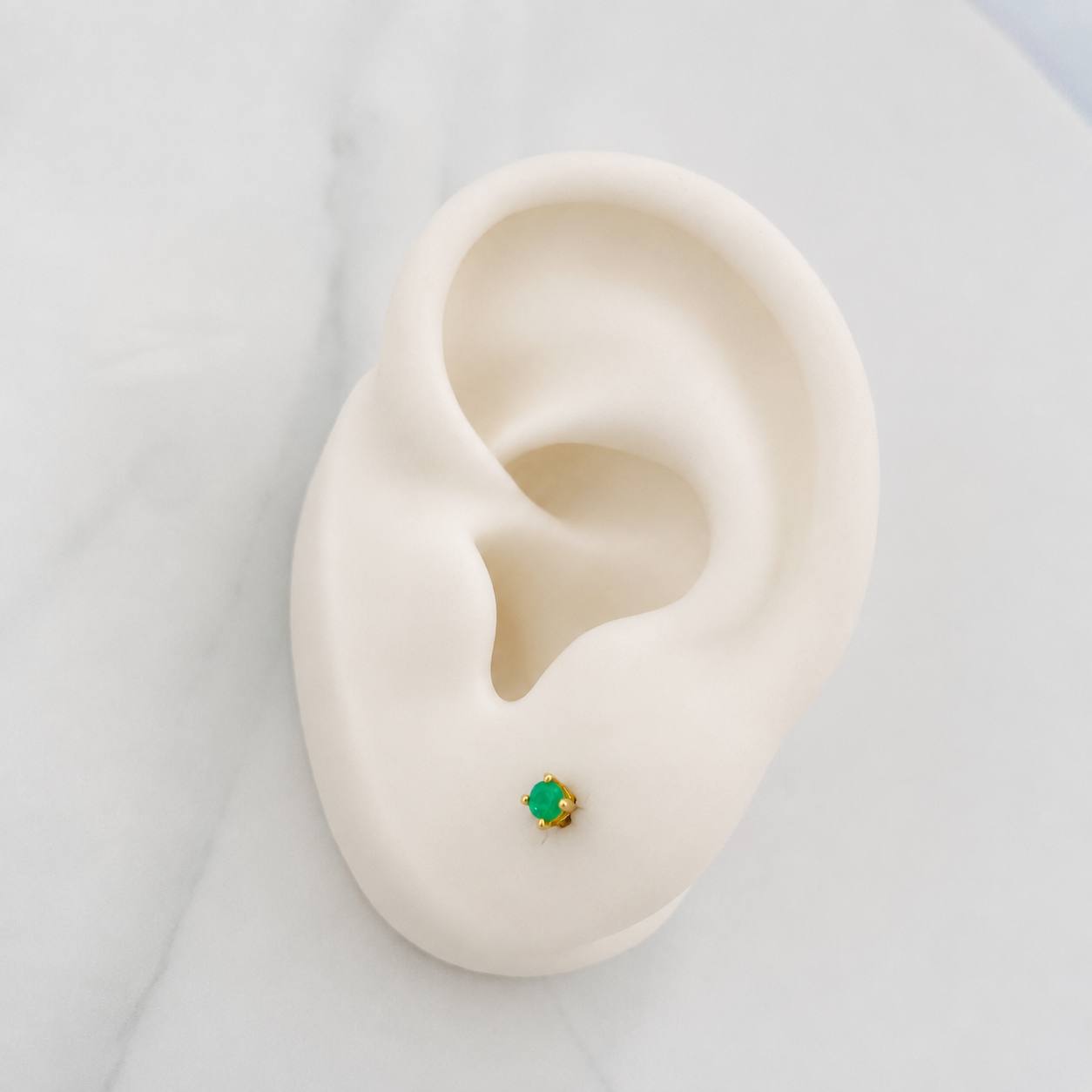 Topos Cuatro Garras Esmeralda 30pts 0.9g / 2mm Oro Amarillo 18K